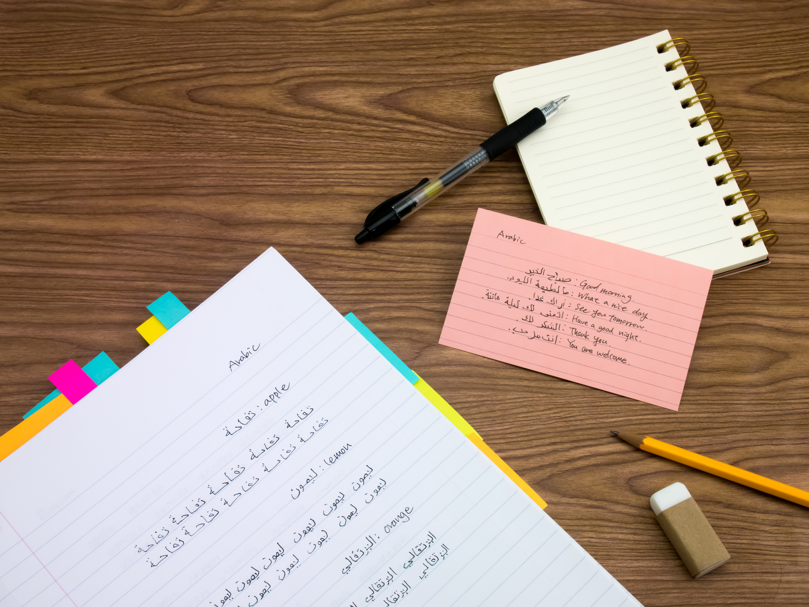 Arabic; Learning New Language Writing Words on the Notebook